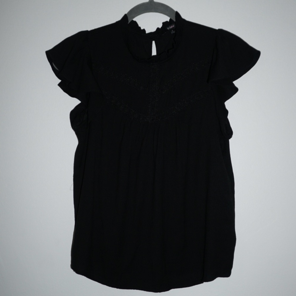 Black Linen ruffle top with lace up details. Size S.